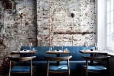 The Musket Room (New York, New York) Winner of the Restaurant and Bar Design Award for Best Restaurant in the Americas, the Musket Room is an effortlessly charming 70-seat eatery in the heart of downtown Manhattan, complete with midcentury chandeliers, a walnut bar, and backyard garden. Here, teal upholstered banquets line a wall of lime-washed exposed brick. Courtesy of Alexander Waterworth Interiors.